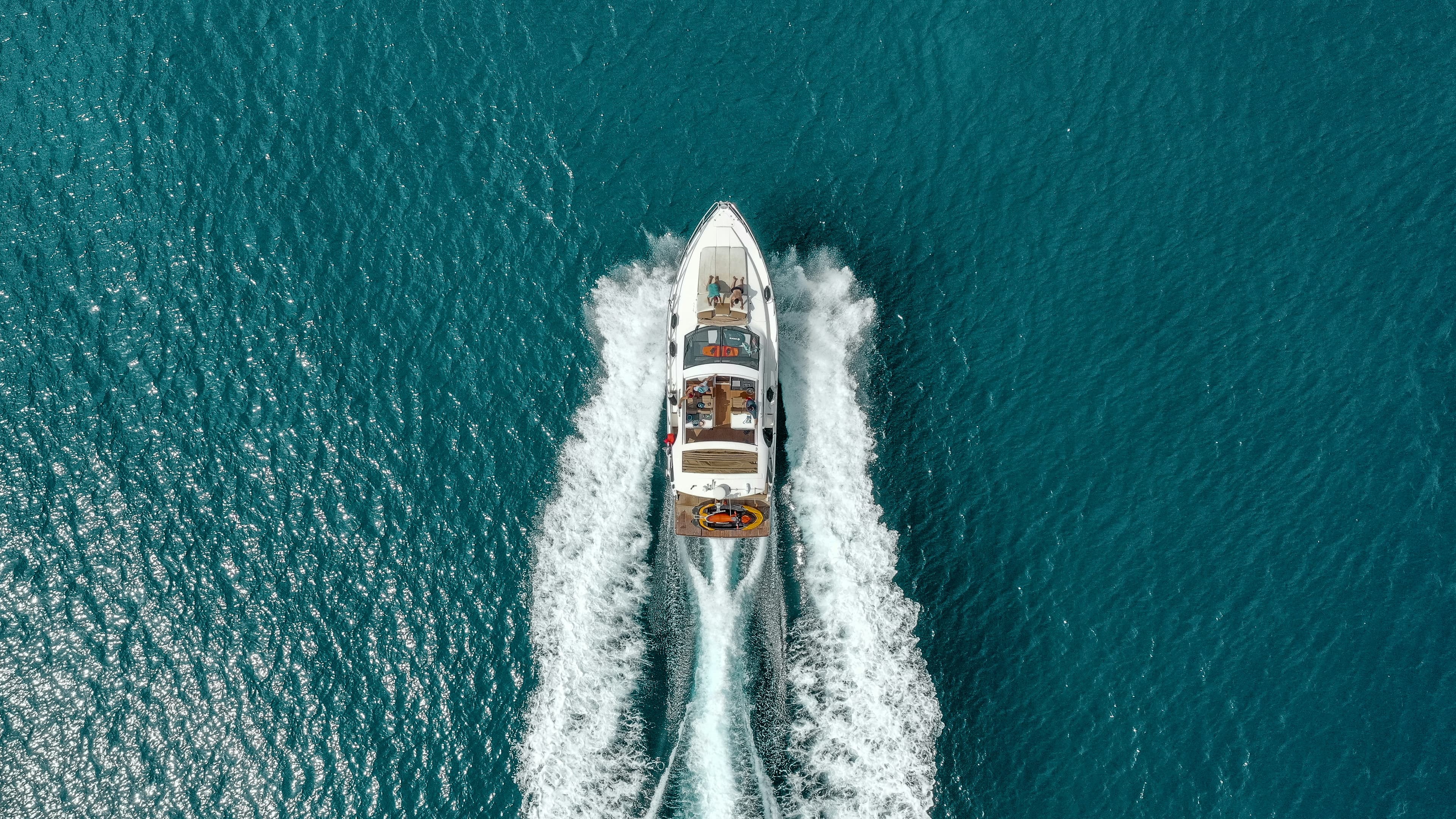 Aerial view of a luxury yacht and tender