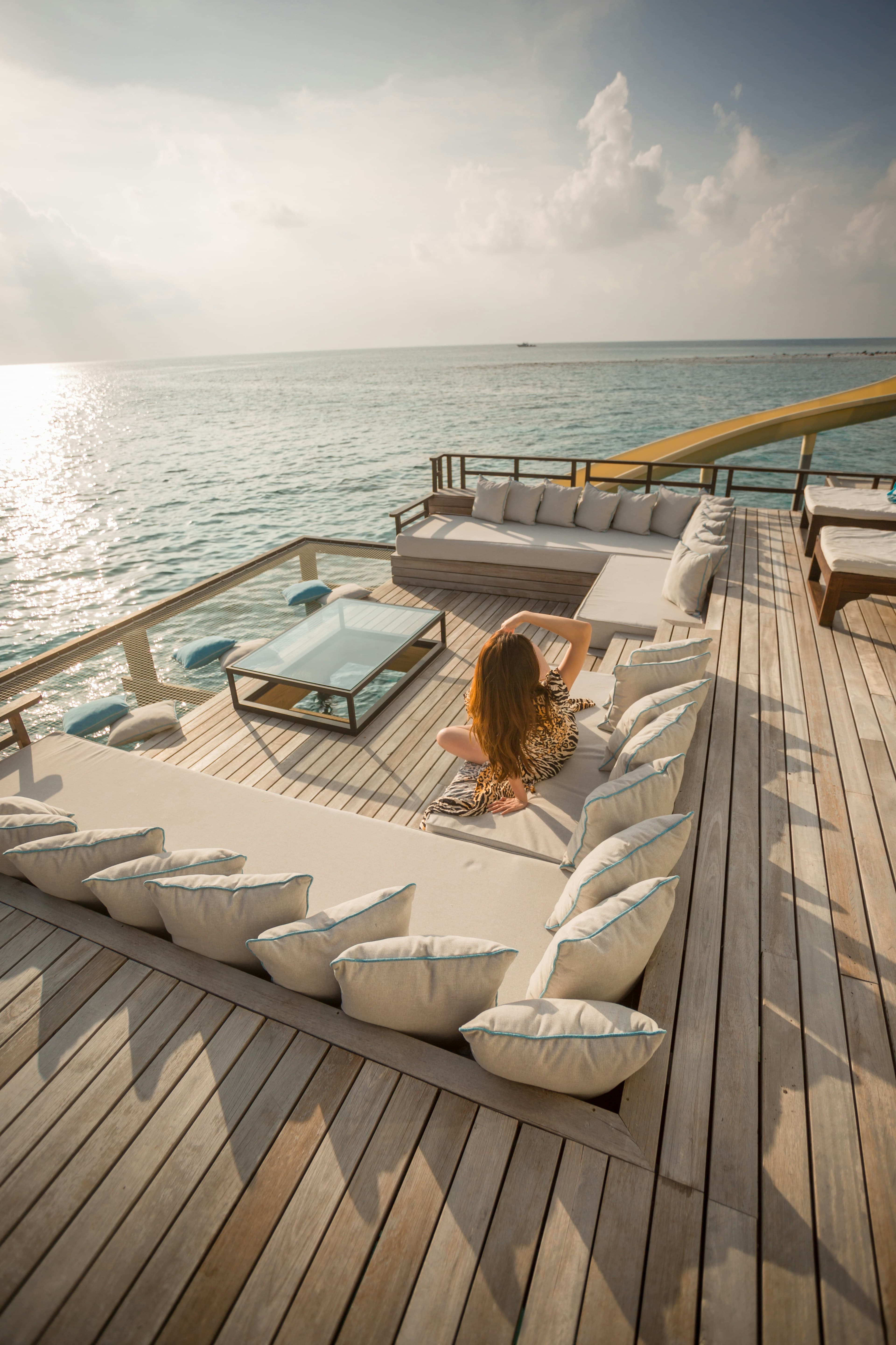 Yacht cruising past a Mediterranean coastline